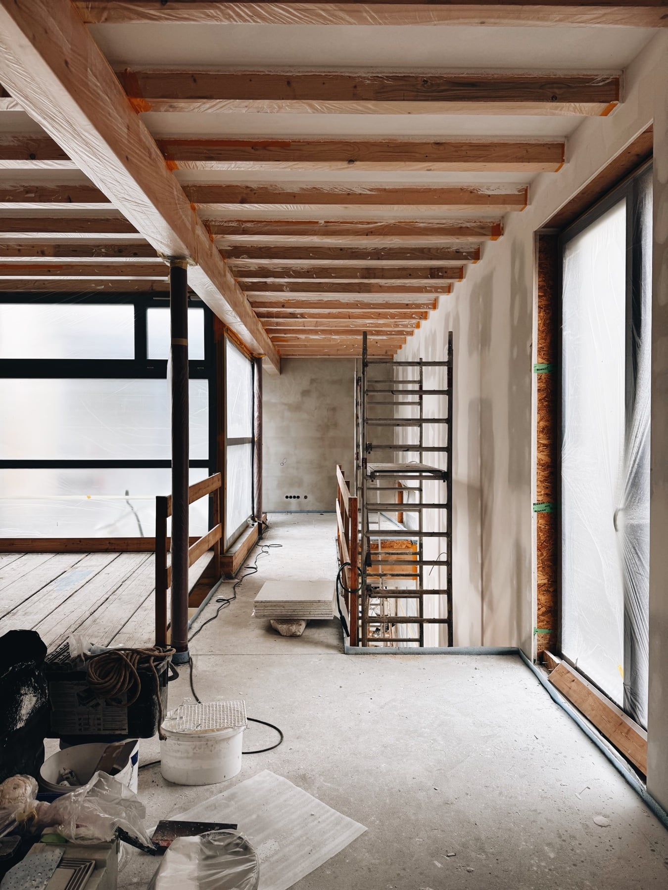 The loft as a shell, looking towards the stairs