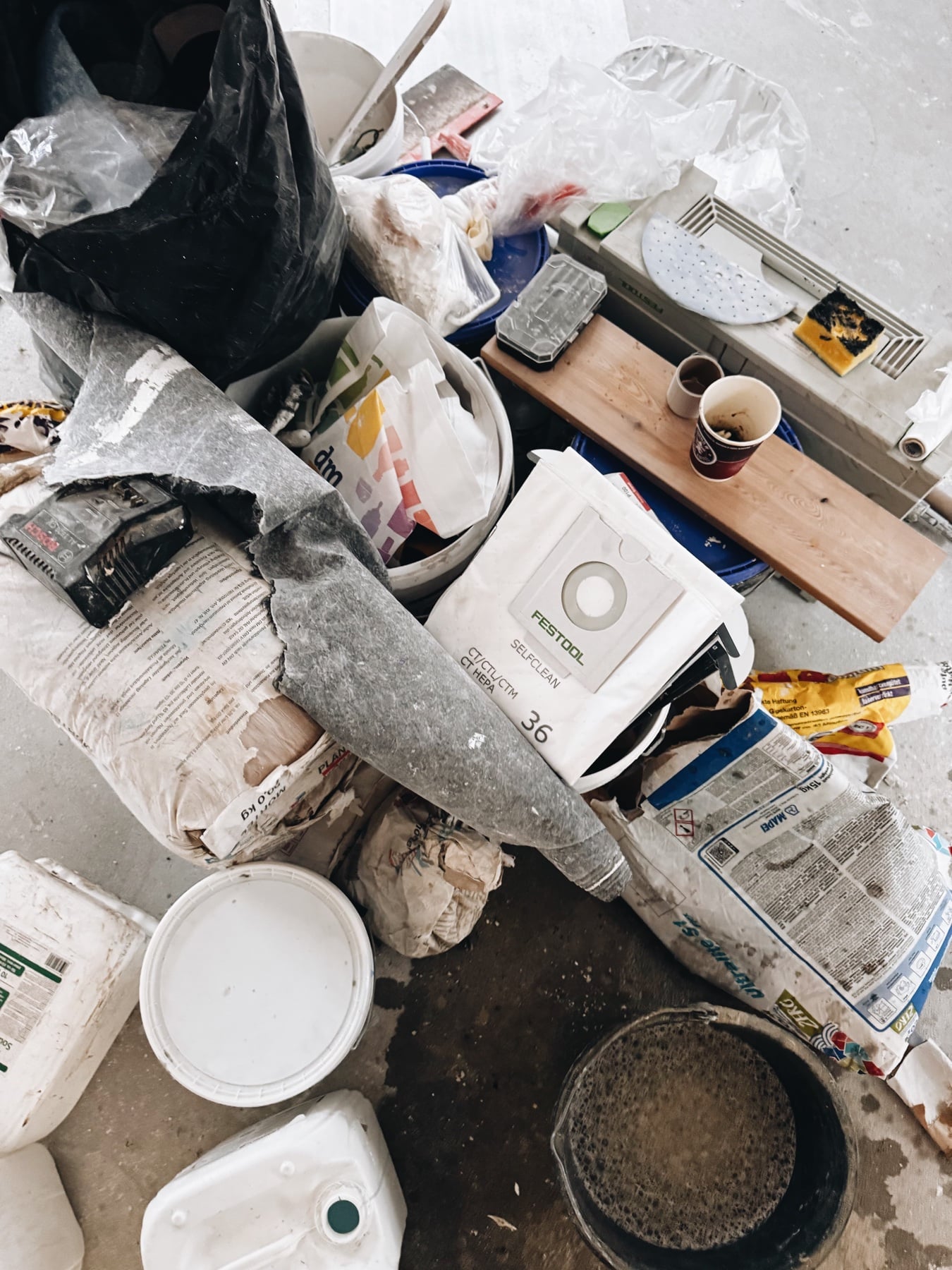 Tools and paint buckets on the floor