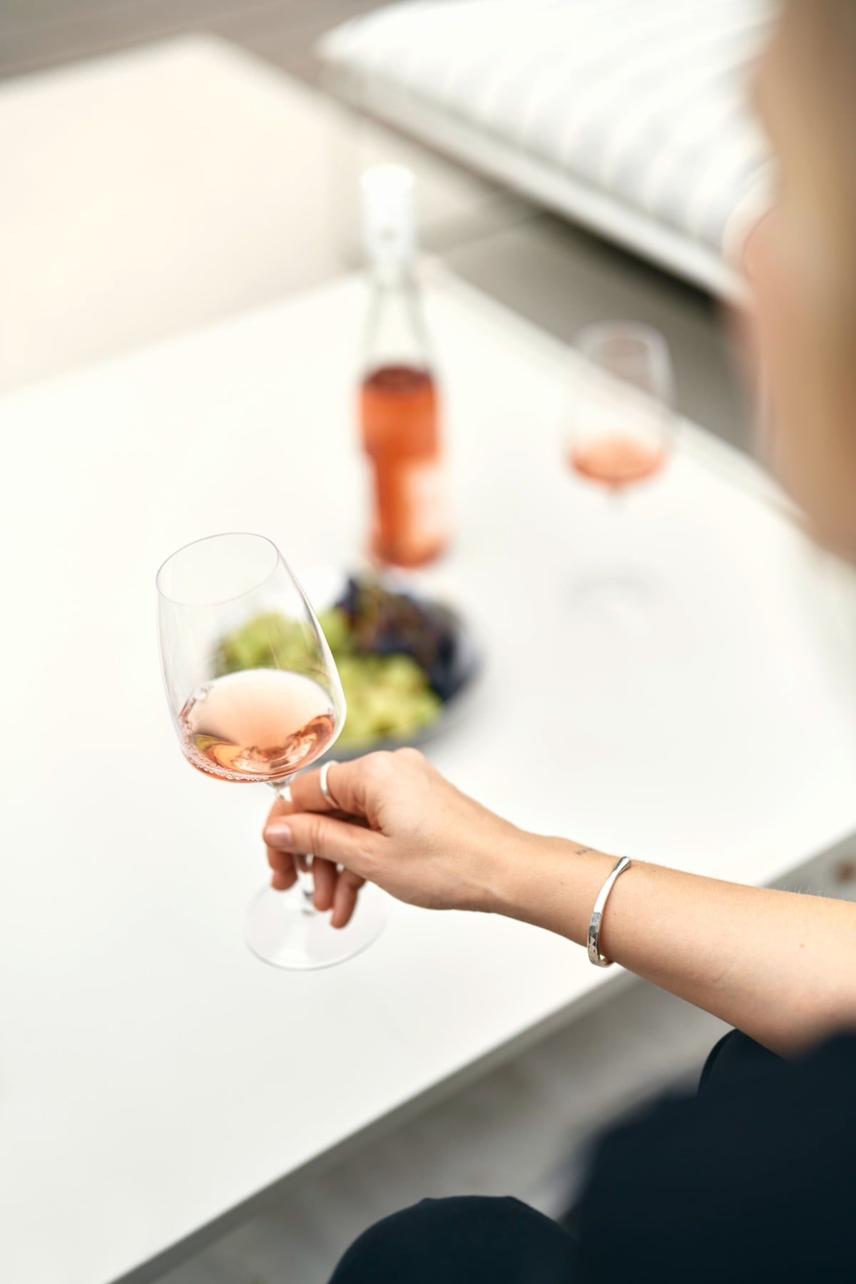 Hand with a glass on the roof terrace