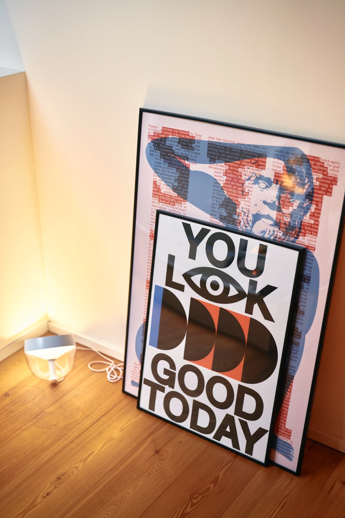 A poster leaning against the wall in the corner