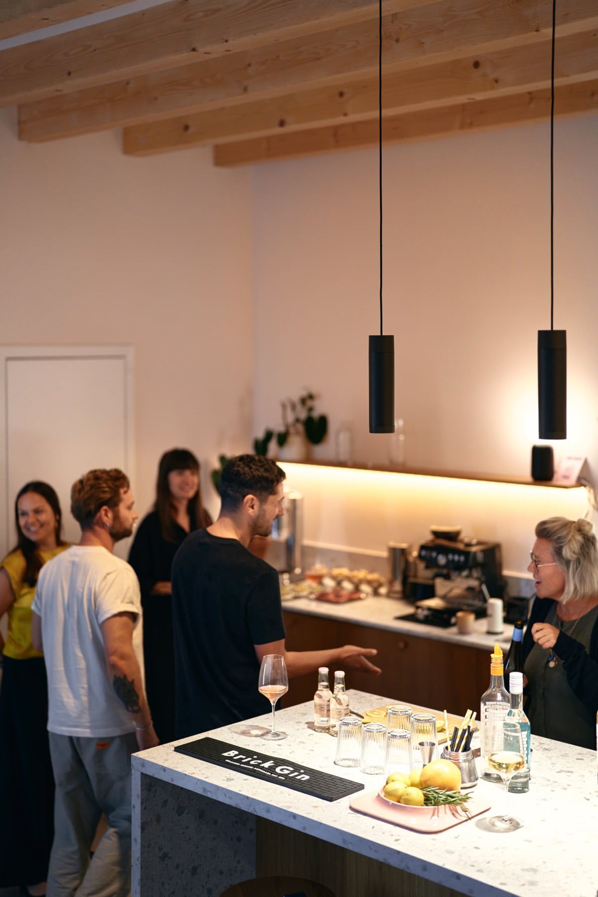 Guests at the bar with the gin station